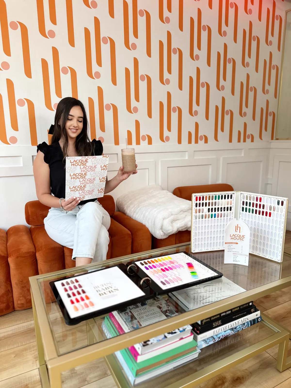 Cream banquettes and blush pillows inside Lacque House